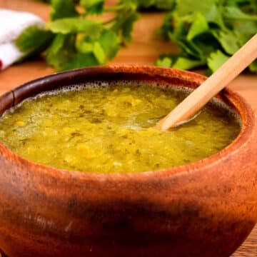 Tomatillo salsa in a wooden bowl.