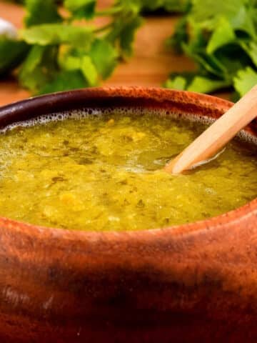 Tomatillo salsa in a wooden bowl.
