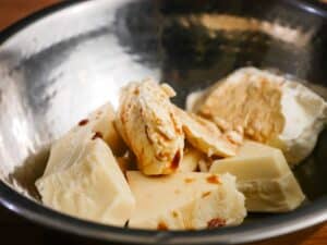 White chocolate and vanilla in metal bowl.
