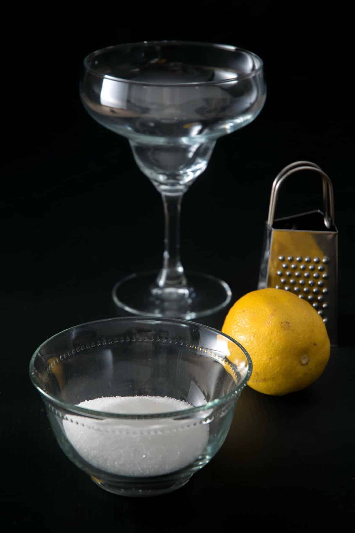 Ingredients and tools for glass rim on black background.