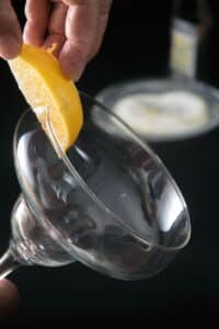 Lemon wedge on a martini glass.