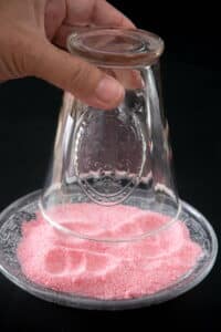 Cocktail glass dipped in pink sugar.