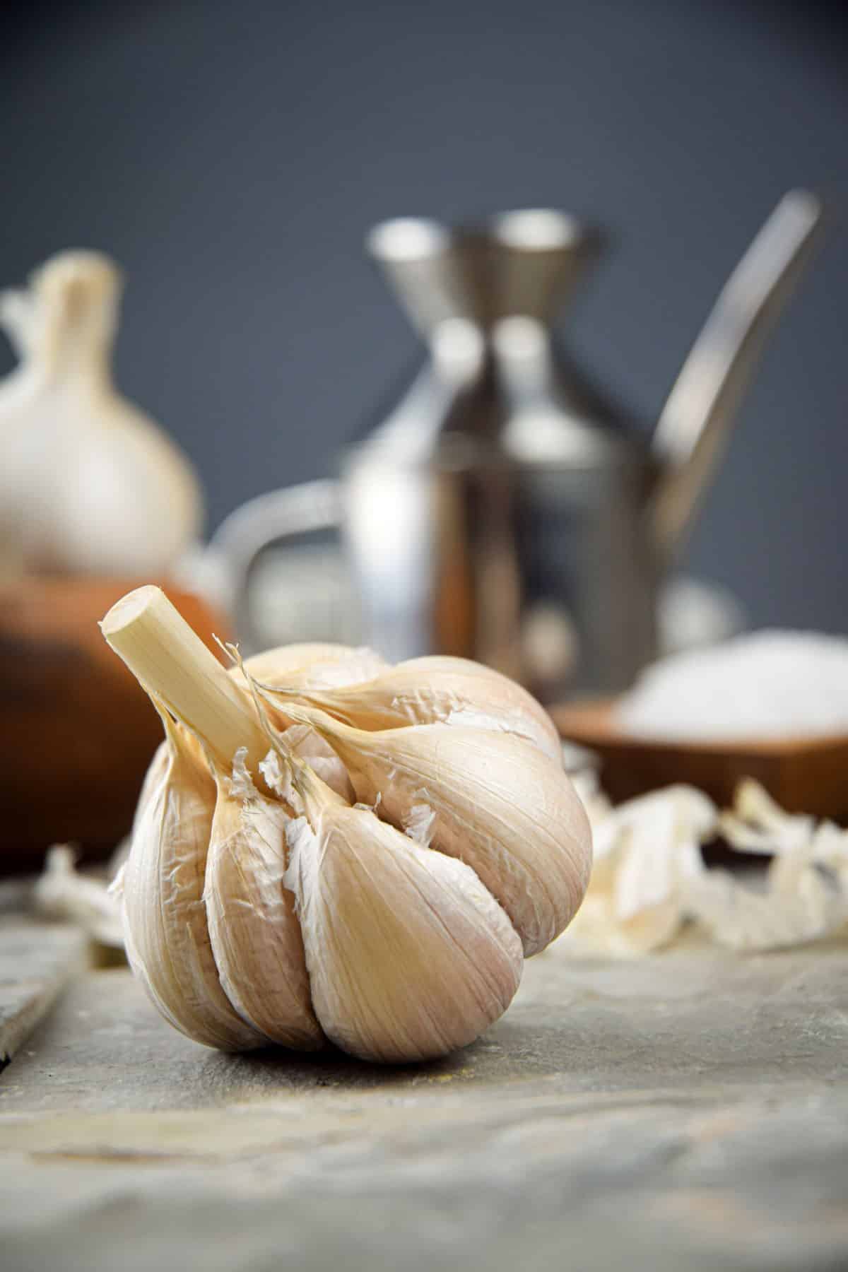 Head of garlic with outer layer removed.