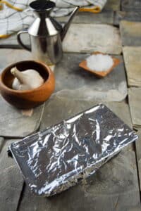Loaf pan covered in foil.