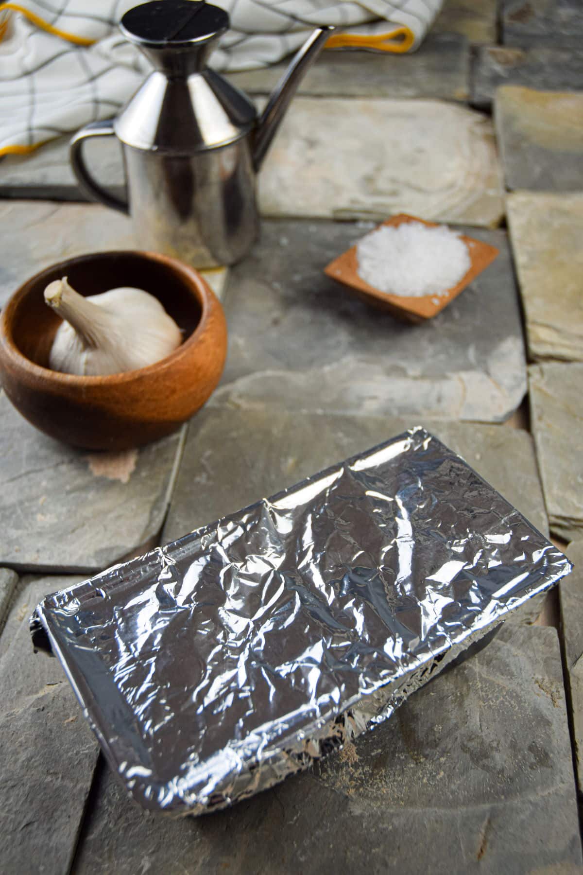 Loaf pan covered in foil.