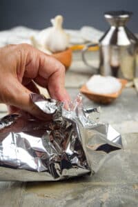 Foil wrapped around garlic head.