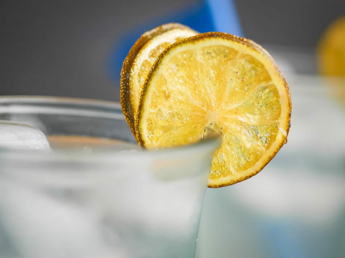 How to Candy Limes-Final 3 Candied limes as a garnish on a cup.