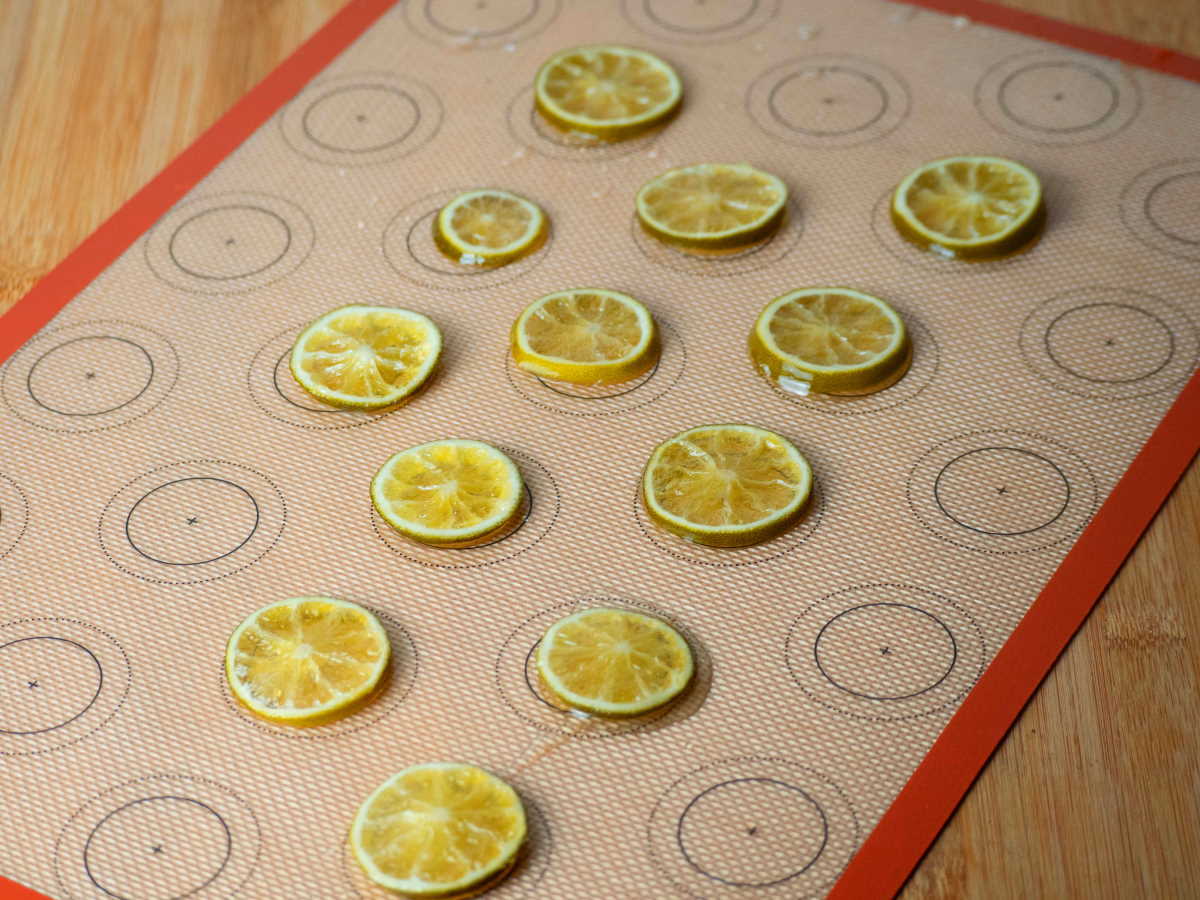 How to Candy Limes - Step 6 Candied limes sitting on a silicone mat.