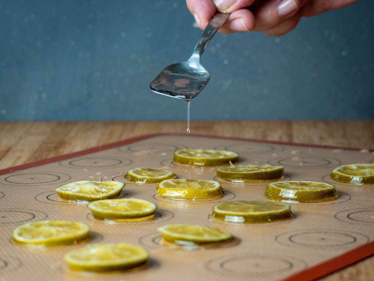 How to Candy Limes - Step 7 Candied limes sitting on a silicone mat.