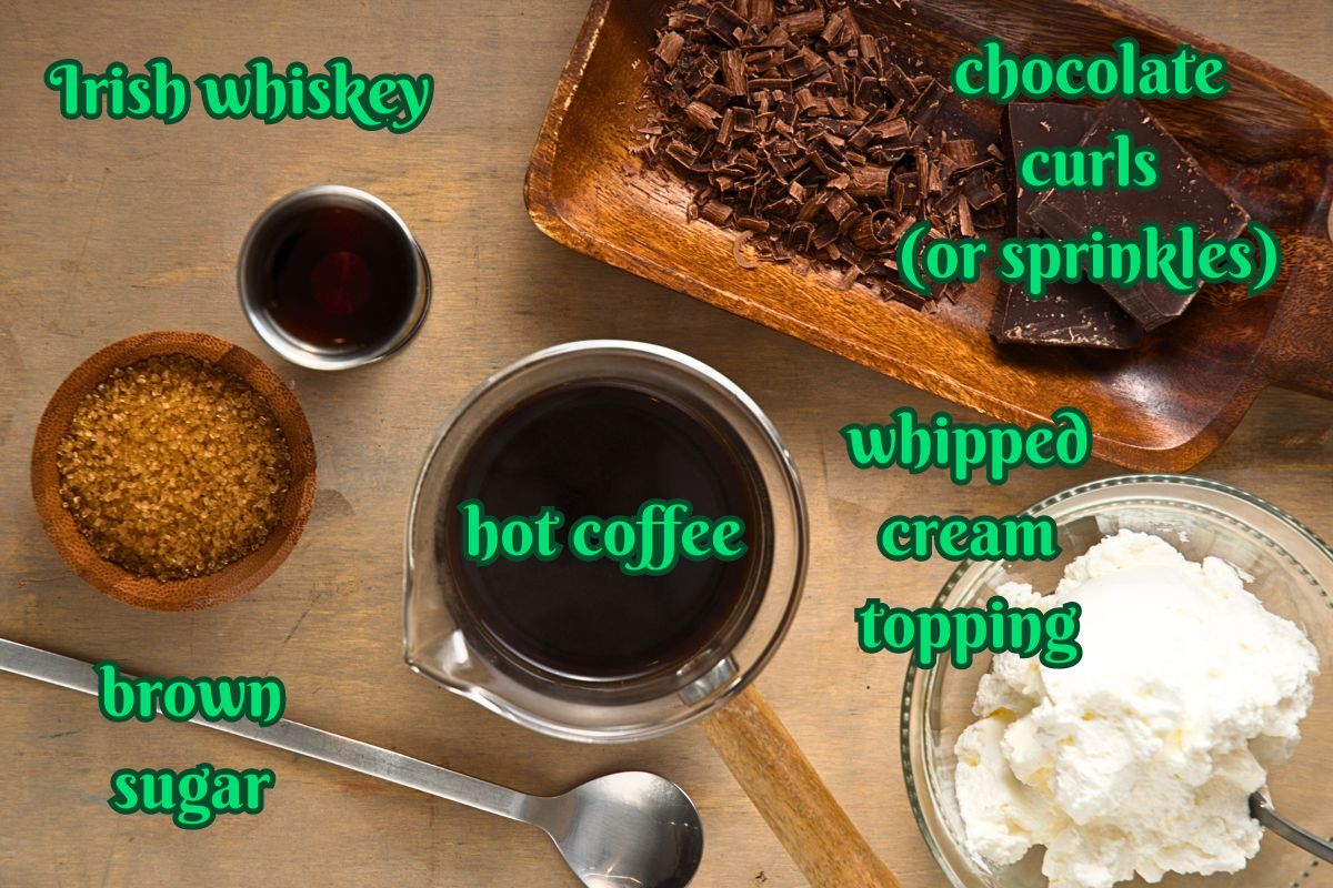 Irish coffee ingredients prepped and labeled on brown background.