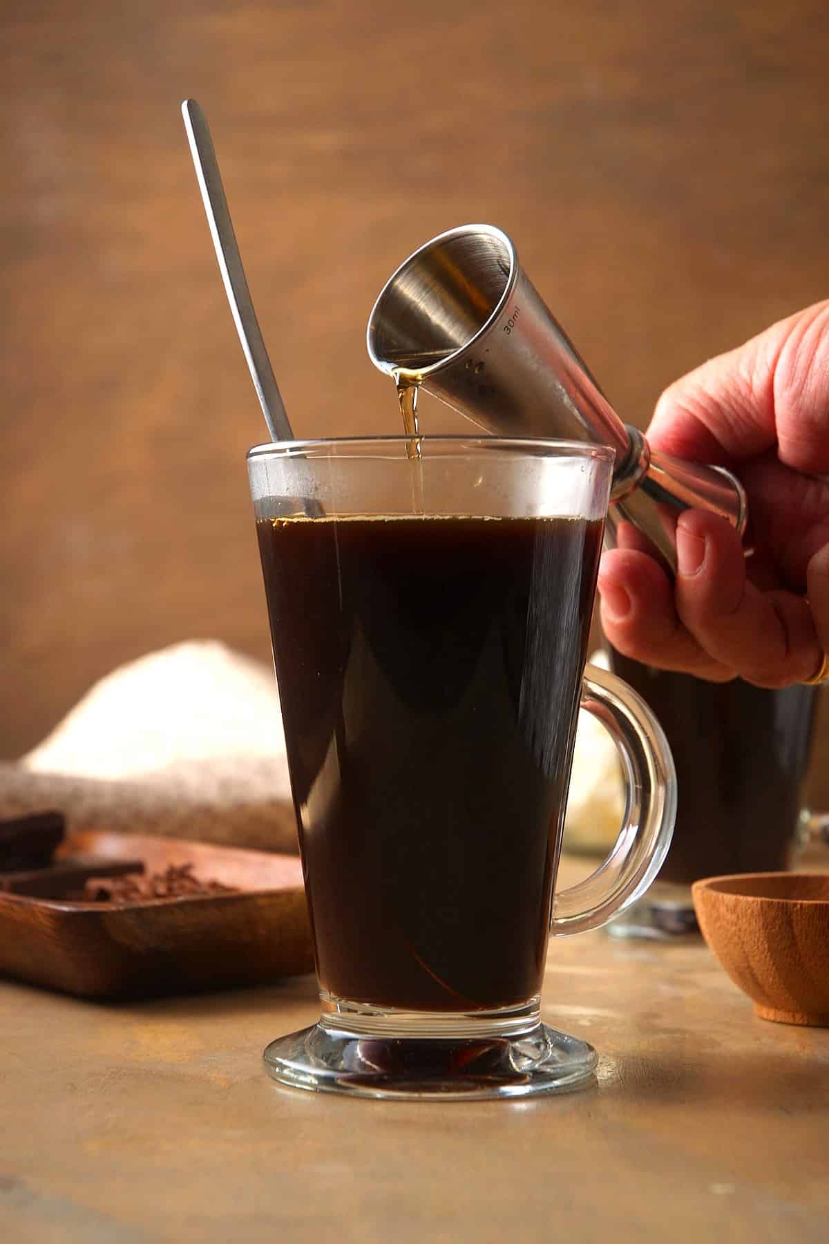 Hot coffee and whiskey in Irish coffee mug.