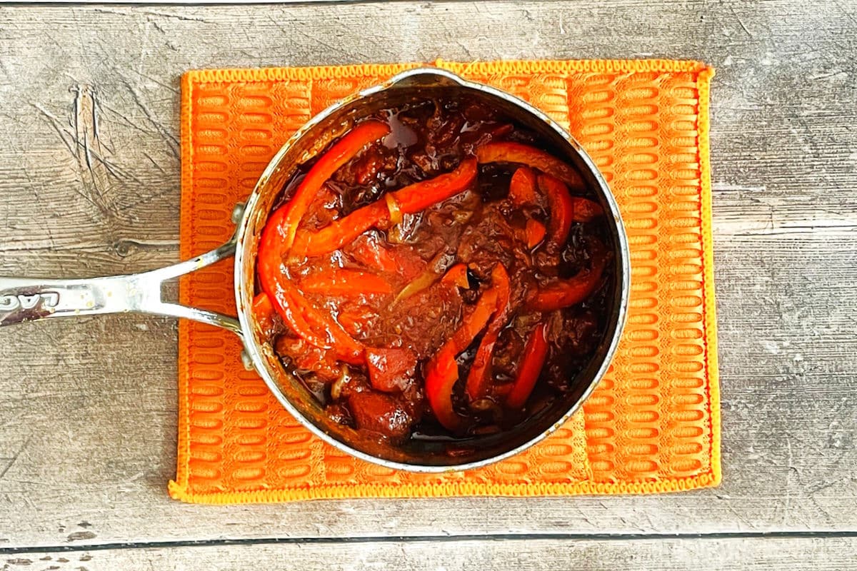 Red pepper sauce in small saucepan.