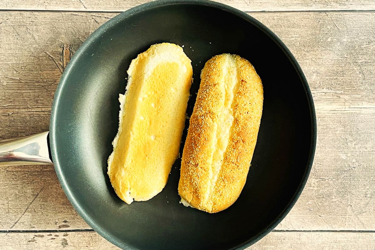 Brat buns in pan.