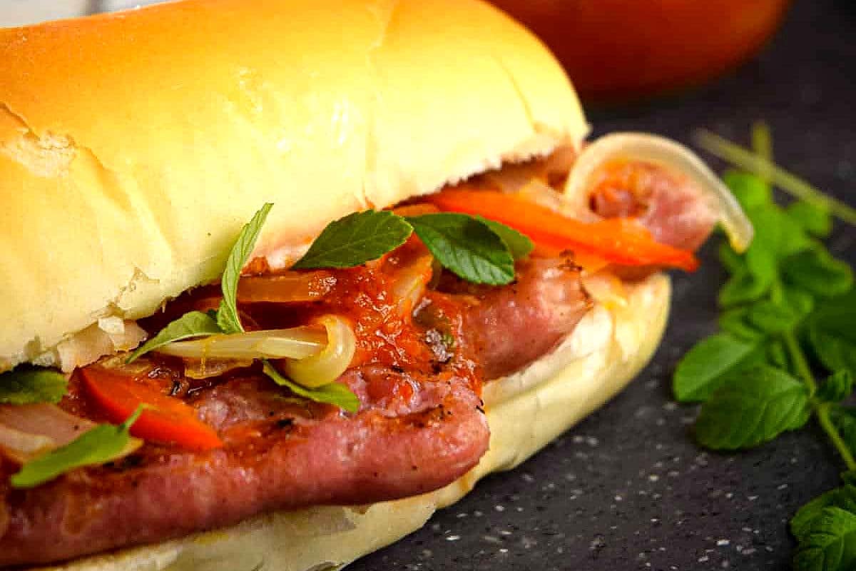 Italian sausage sandwich with fresh oregano.
