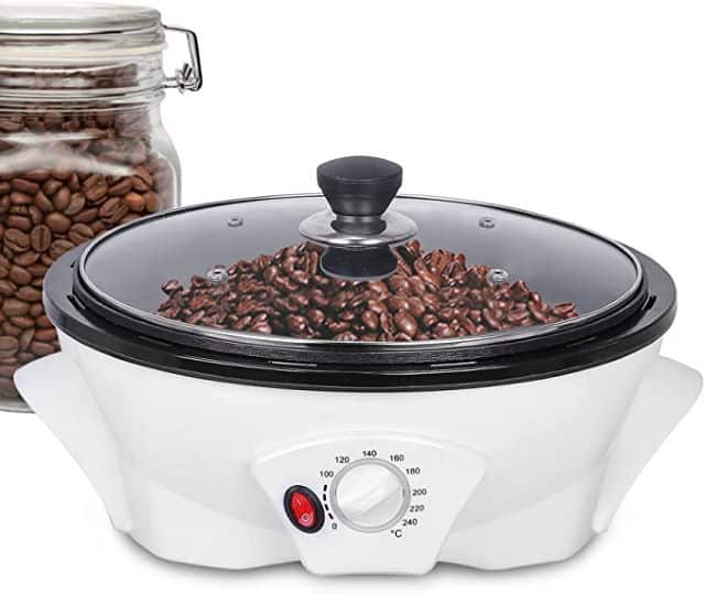 Jiawanshun Home Coffee Bean Roaster on white background. Jar of coffee beans in the background.