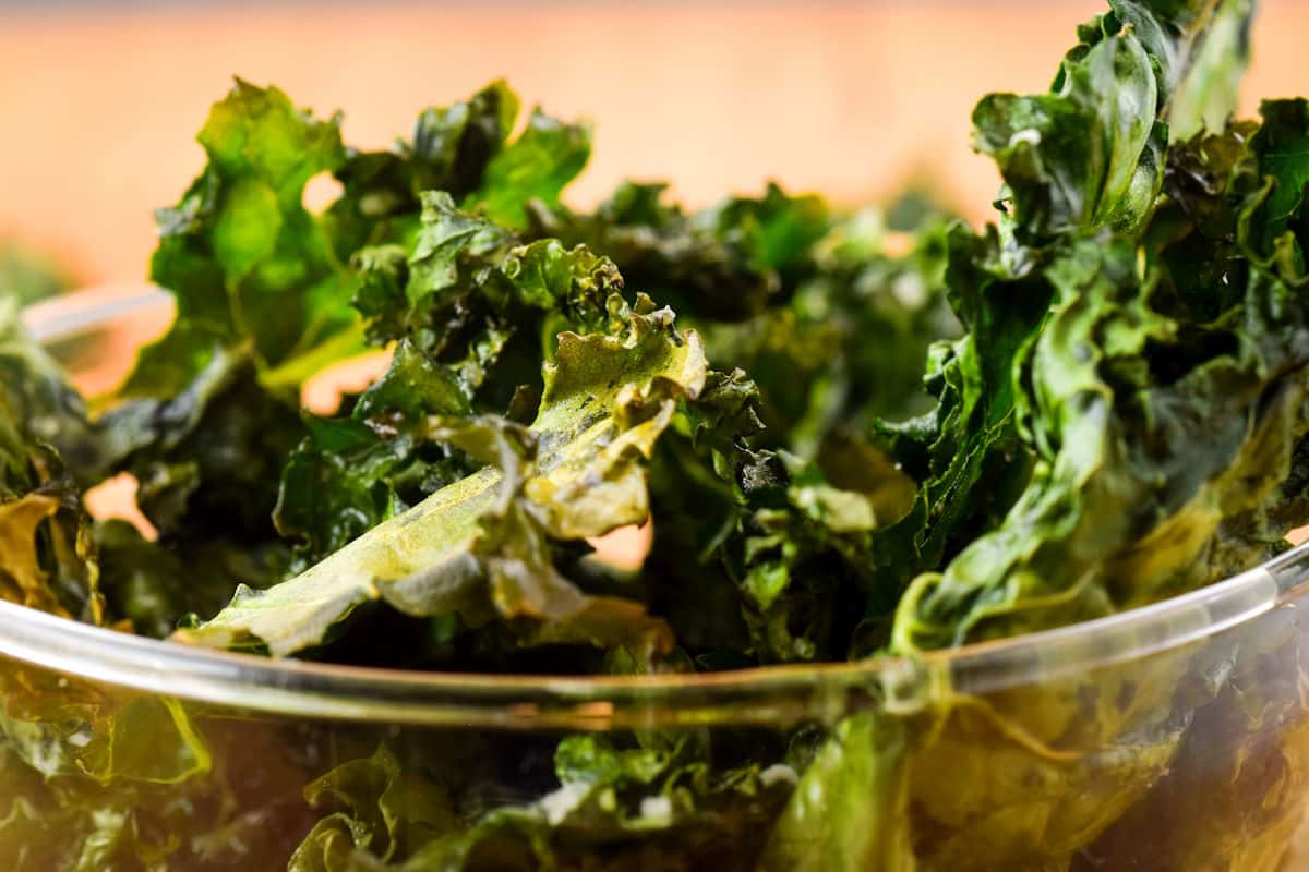 Kale chips in glass container.