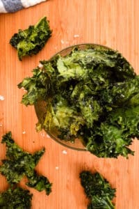 Kale chips in glass container.