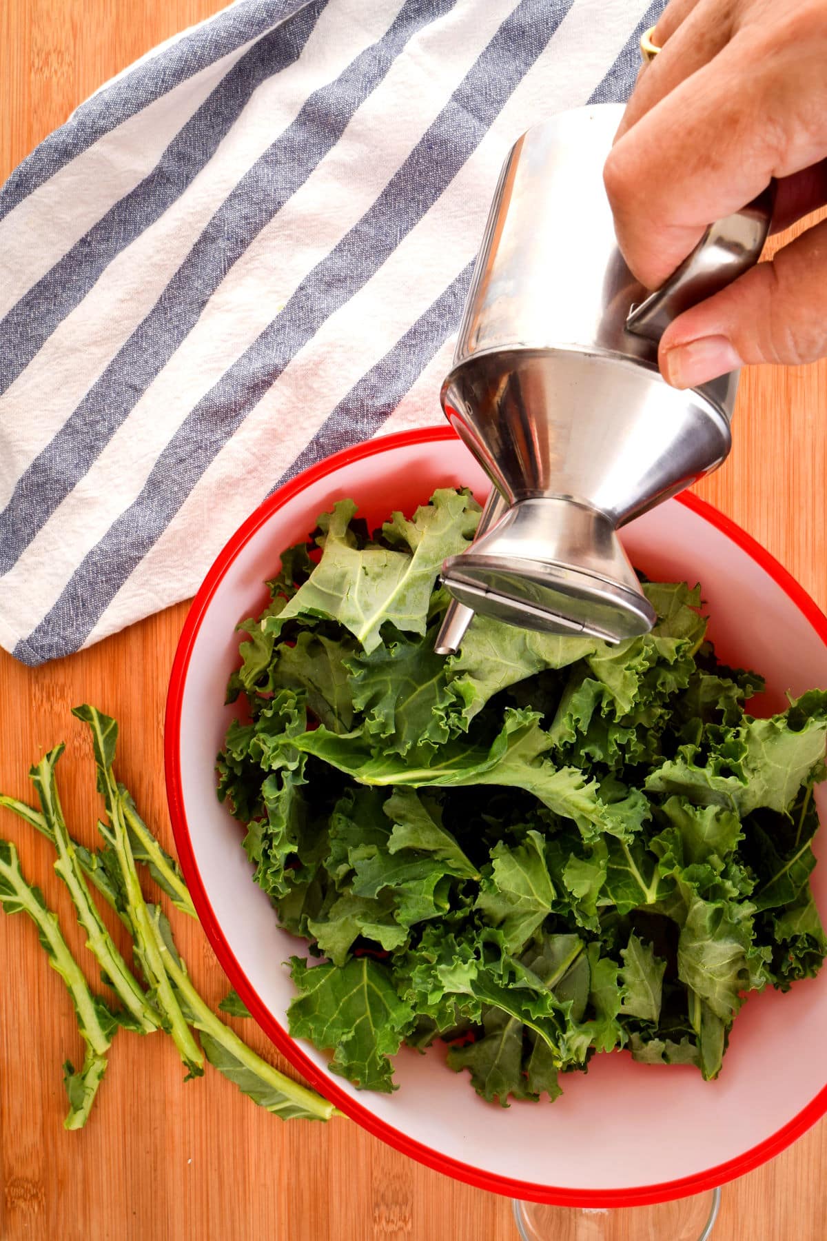 Kale in bowl with olive oil.