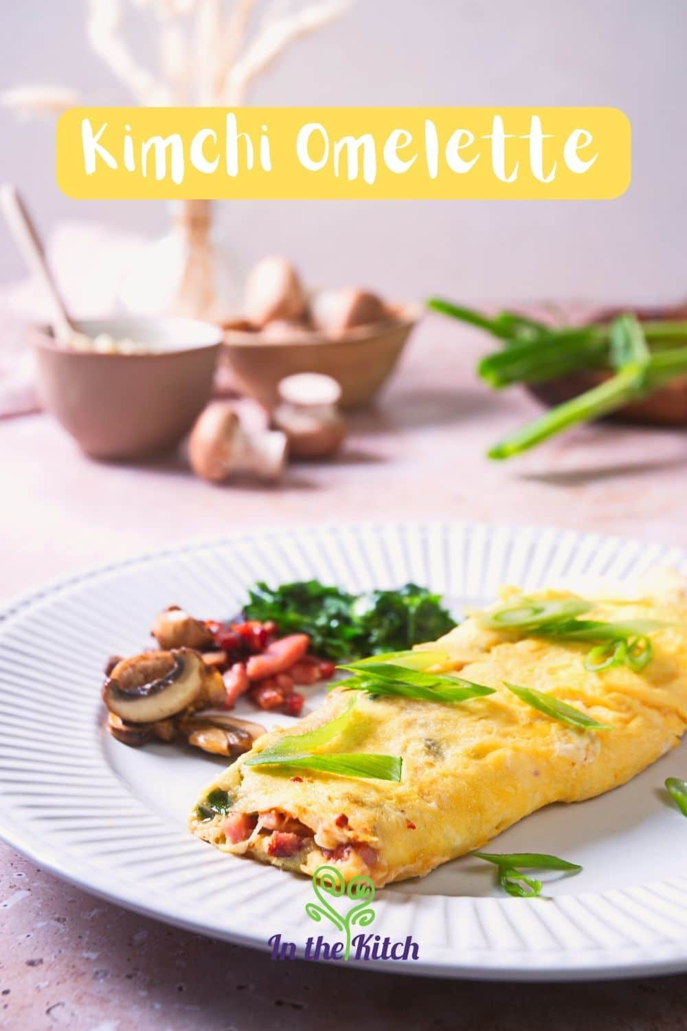 Korean kimchi omelette on plate with text overlay that says "Kimchi Omelette'.