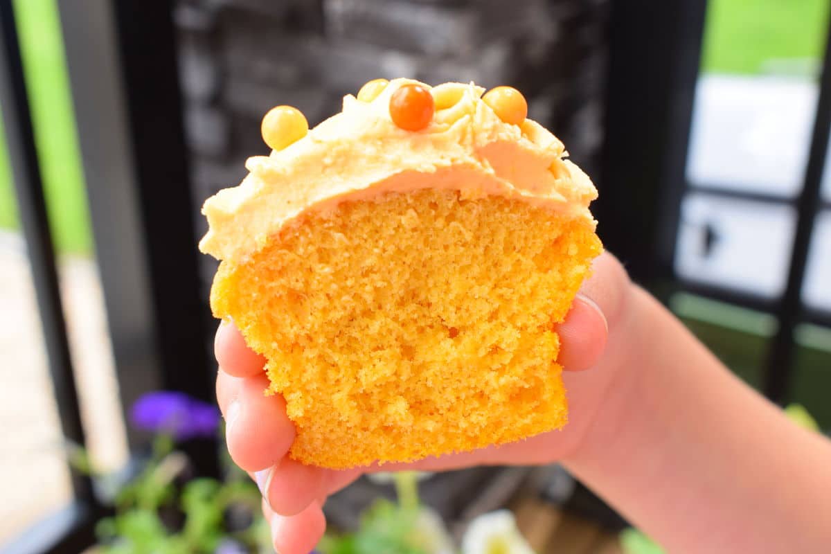 Pumpkin cupcake sliced open.