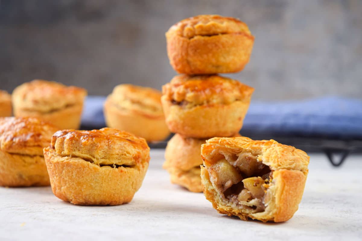 Mini apple pies stacked.