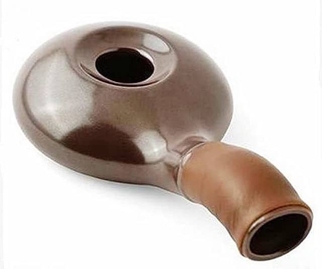 Ceramic manual coffee roaster on white background.