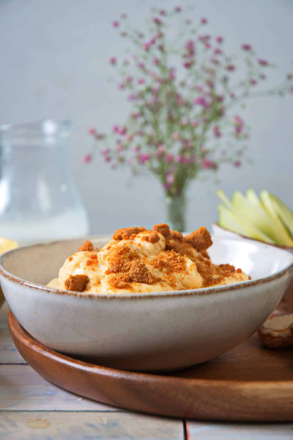 Pumpkin fluff dessert dip with Biscoff cookies in small bowl.