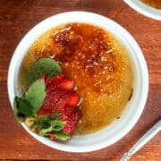 Raspberry Coulis Crème Brûlée in a ramekin.