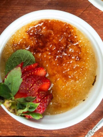 Raspberry Coulis Crème Brûlée in a ramekin.