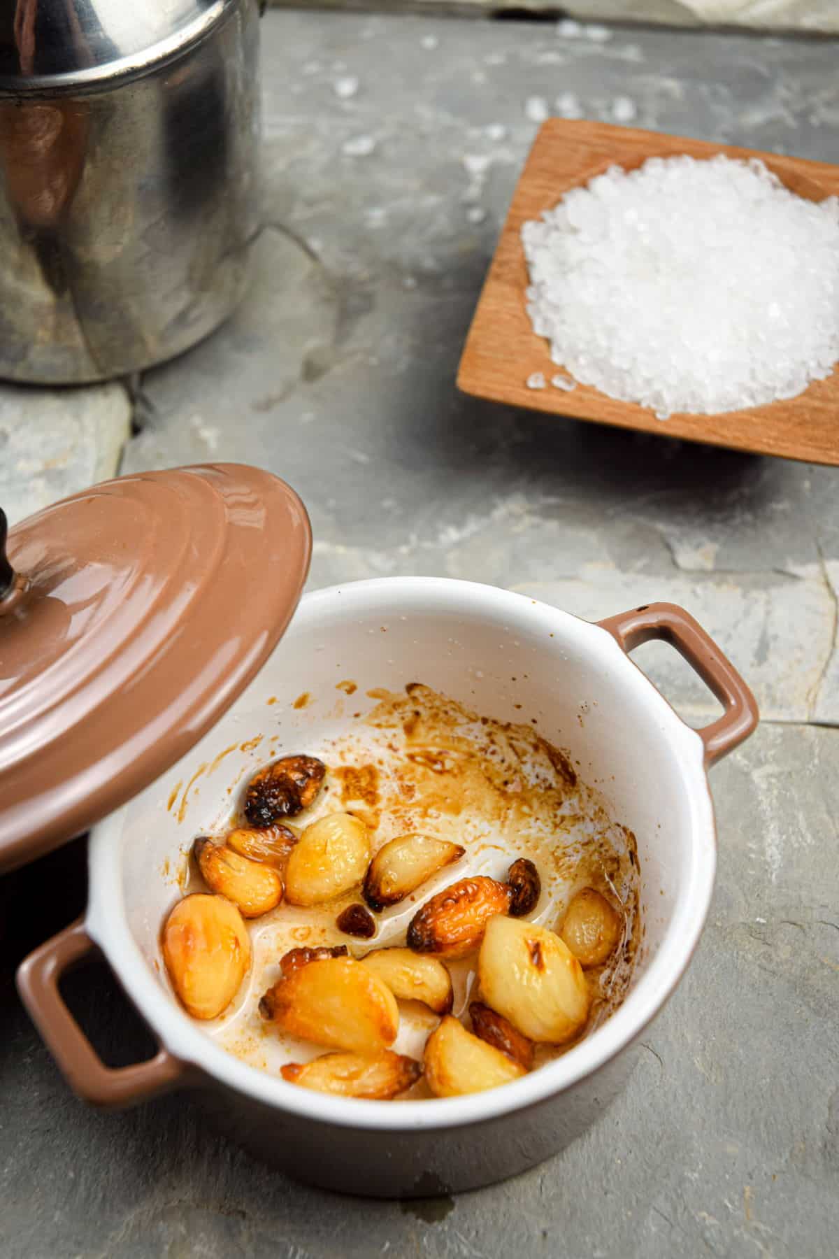 Roasted garlic cloves in small baking dish.