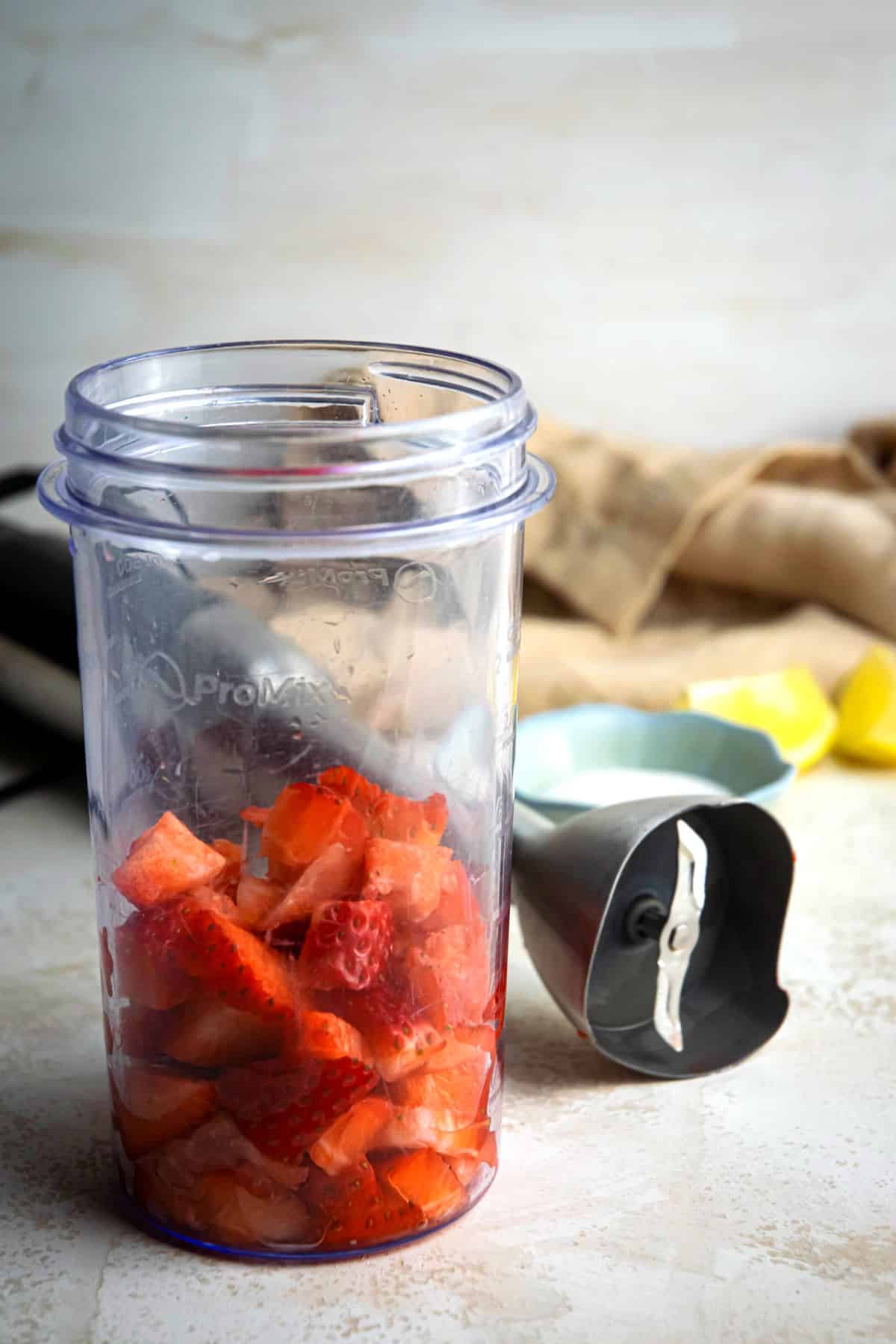 Chopped strawberries in blender jar.