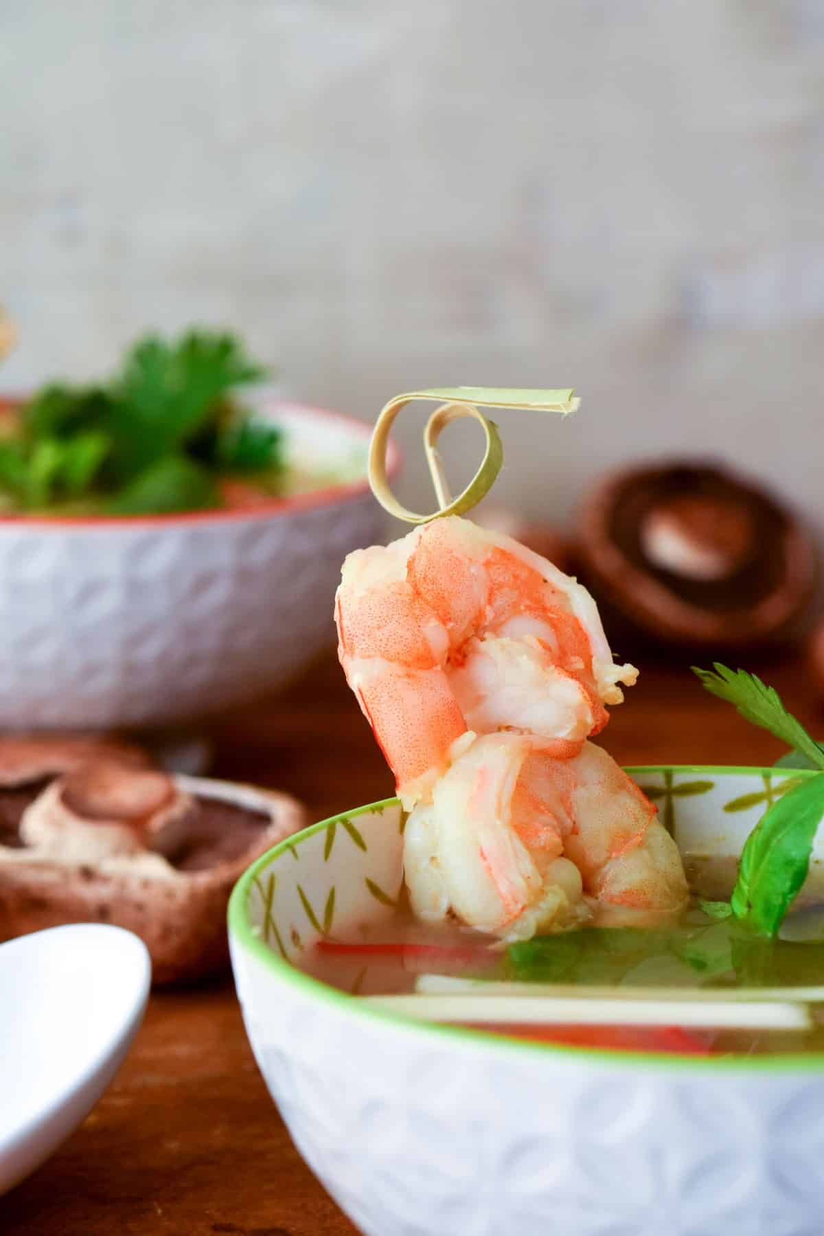 Tom Yum seafood soup in bowl with shrimp.