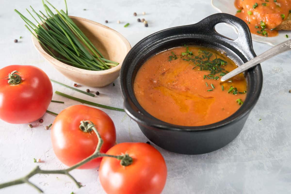 Tomato gravy in a small cast iron bowl.