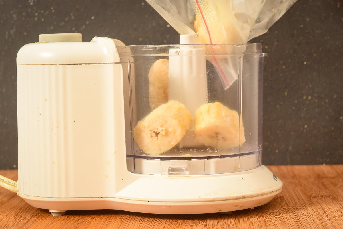 How to Make Banana Ice Cream Step 4 Banana slices in a food processor.