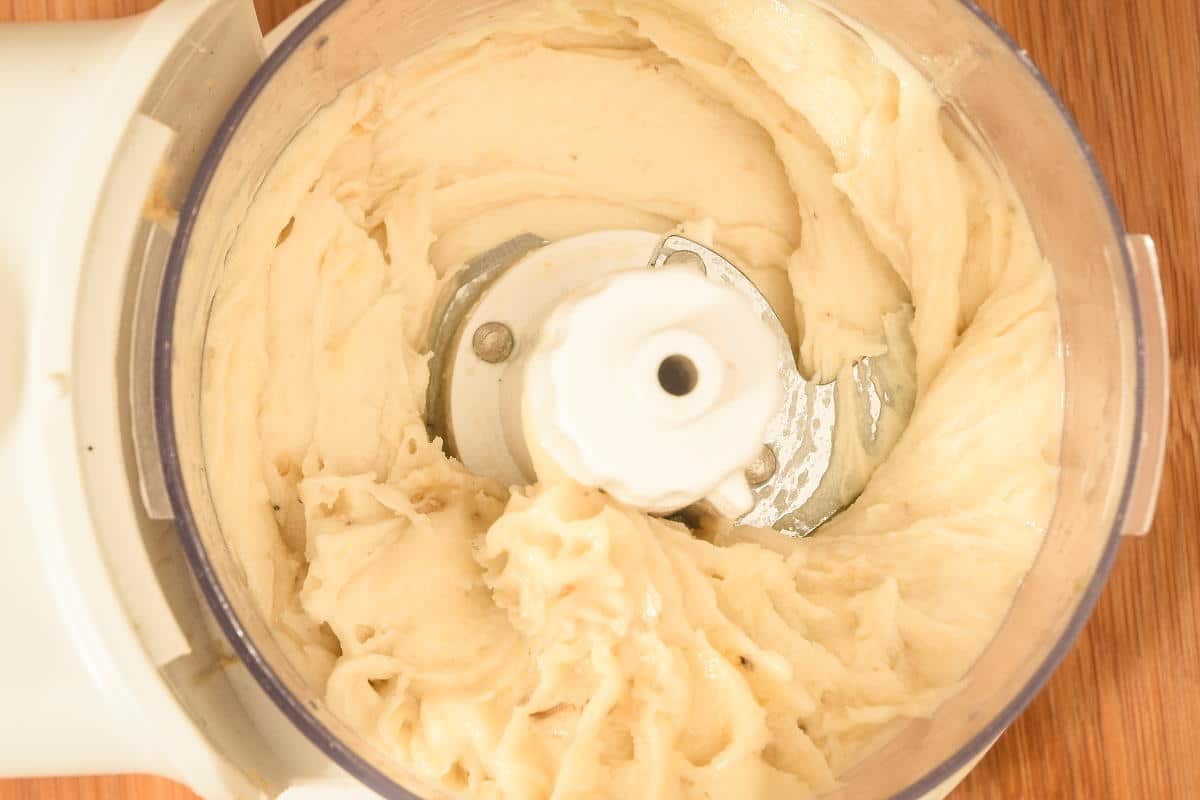 How to Make Banana Ice Cream Step 4-5 Blended banana ice cream in a food processor.