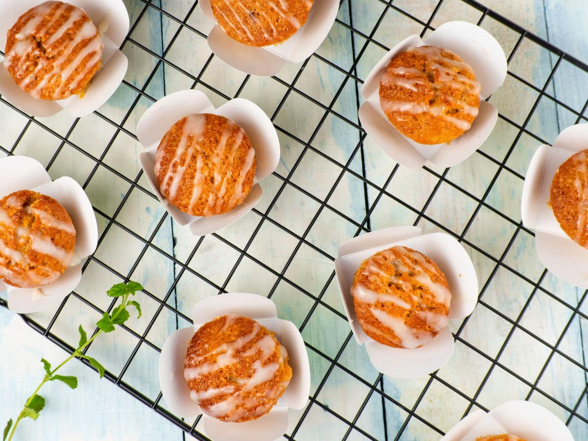 Vegan gluten free carrot cupcakes on baking rack.