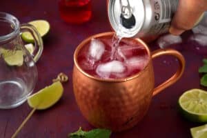 Virgin Moscow Mule in copper mug with can of club soda.