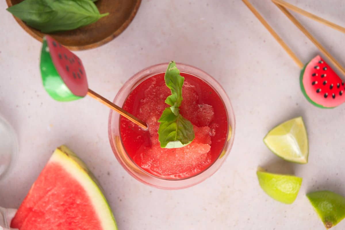 Watermelon basil cocktail in wine glass.