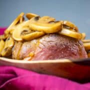 Beef tenderloin covered in mushroom sauce