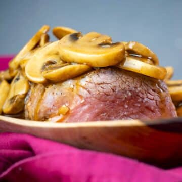 Beef tenderloin covered in mushroom sauce