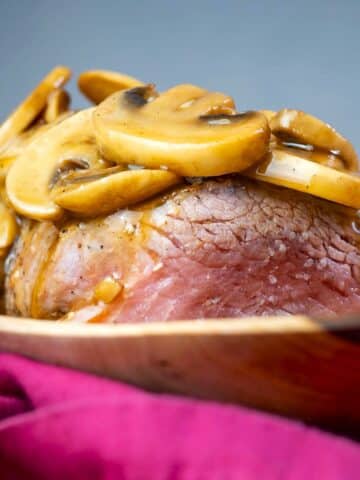 Beef tenderloin covered in mushroom sauce