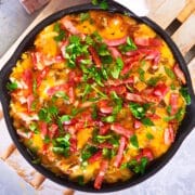 Bison cheeseburger dip in a cast iron pan.