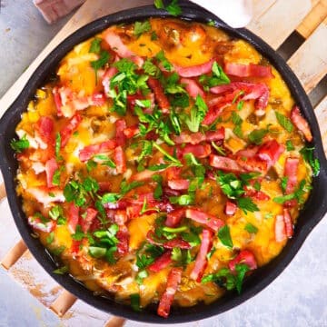 Bison cheeseburger dip in a cast iron pan.