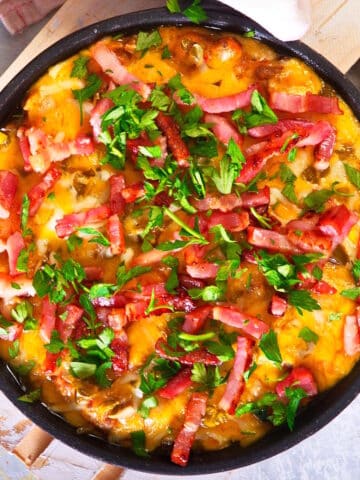 Bison cheeseburger dip in a cast iron pan.
