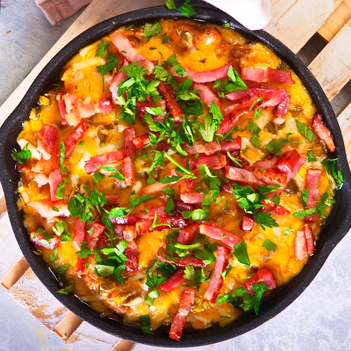 Bison cheeseburger dip in a cast iron pan.