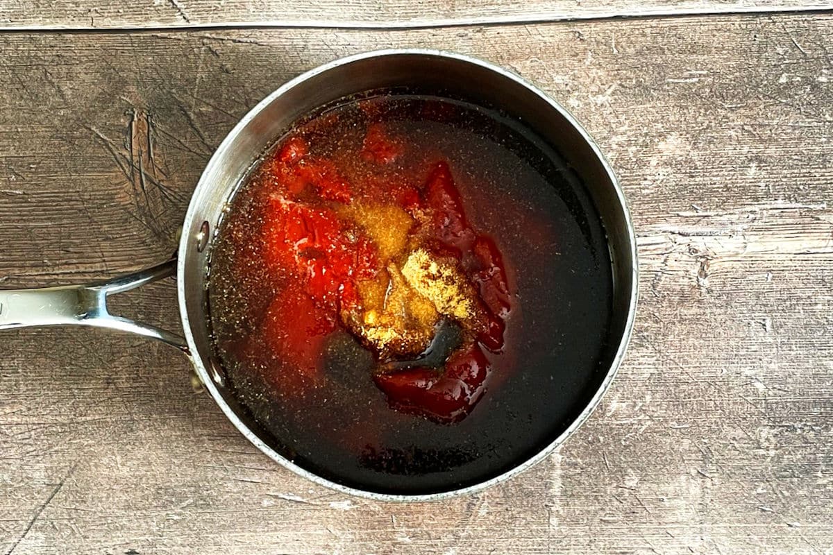 BBQ sauce ingredients in saucepan.