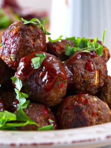 Bison meatballs with BBQ sauce and parsley.
