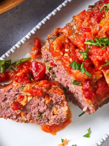 Bison meatloaf sliced on a serving dish.