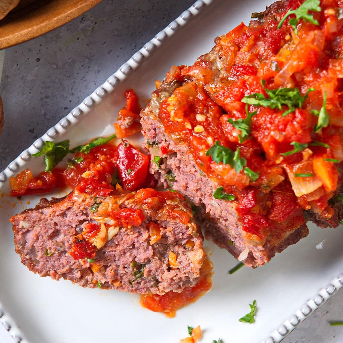 Bison meatloaf sliced on a serving dish.