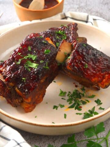BBQ bison short ribs on plate.